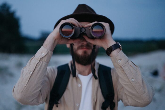 man with binoculars with ideal eye relief